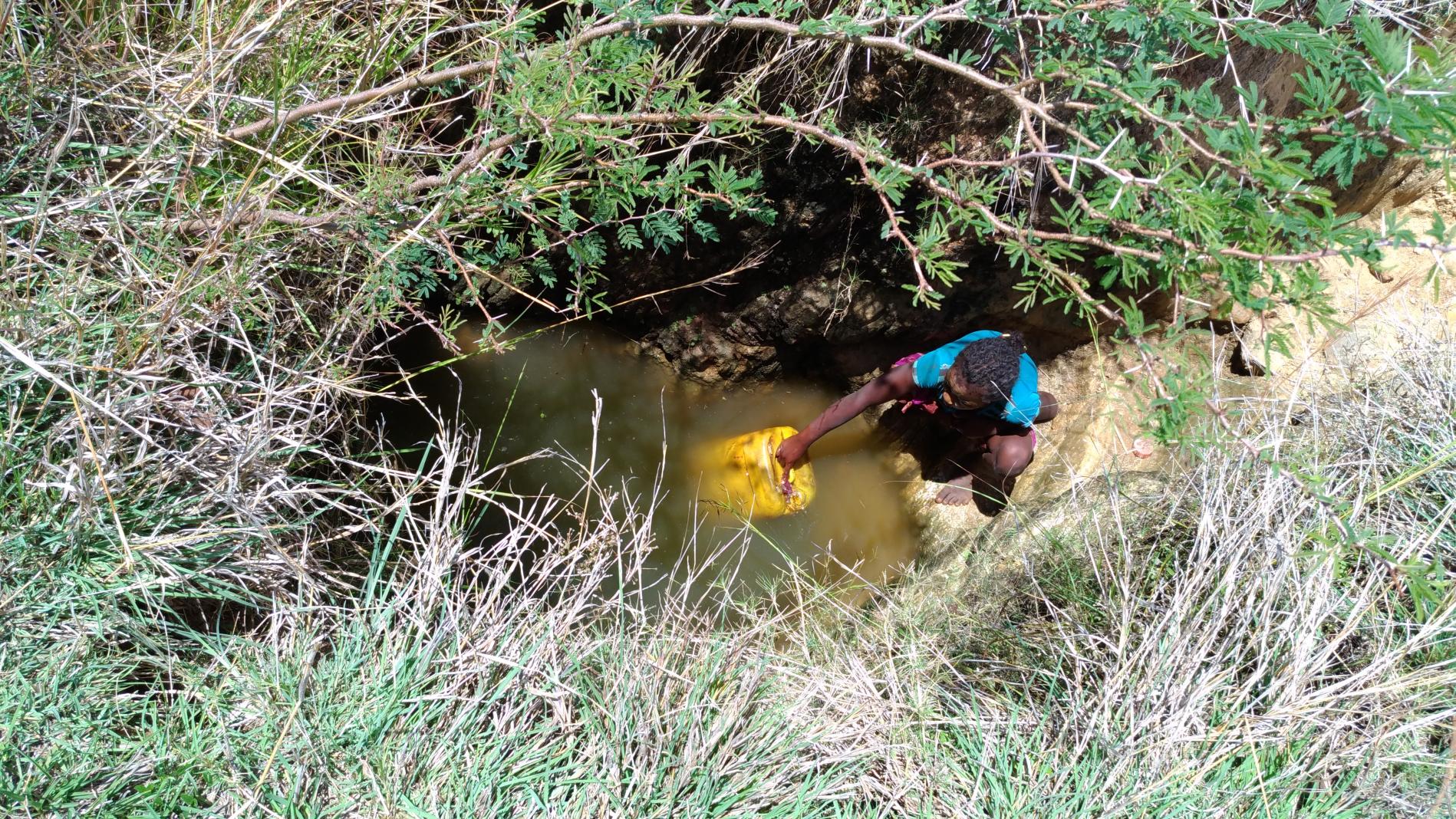 Girl fetching unsafe water 