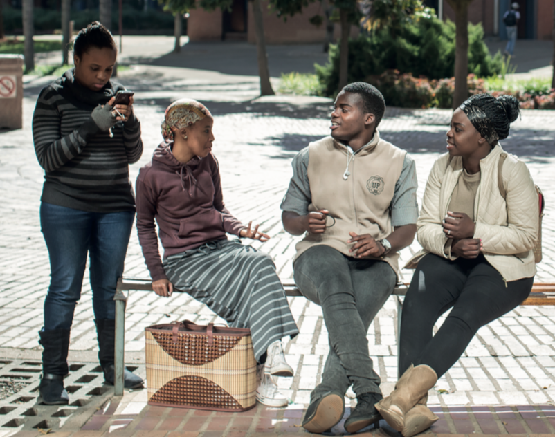 young people discussing amongst themselves 