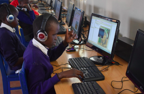 Child using a computer in a lab