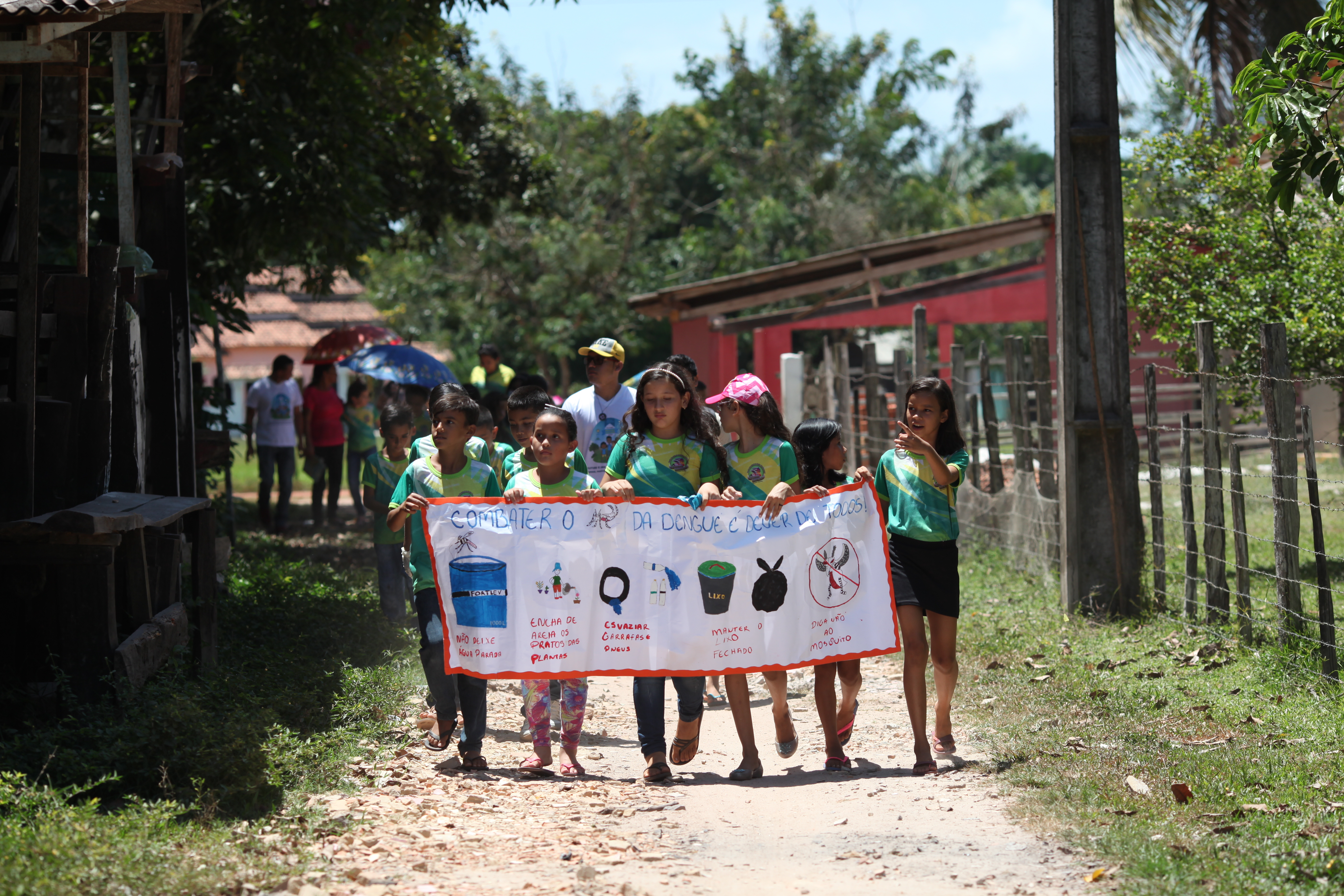 Young girls advocating, holding a banner with message 