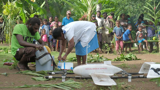 Registered nurse, Miriam Nampil, 55 years, receives the first vaccine delivery from Swoop Aero drone in Cook’s Bay, on 18 December 2018.
