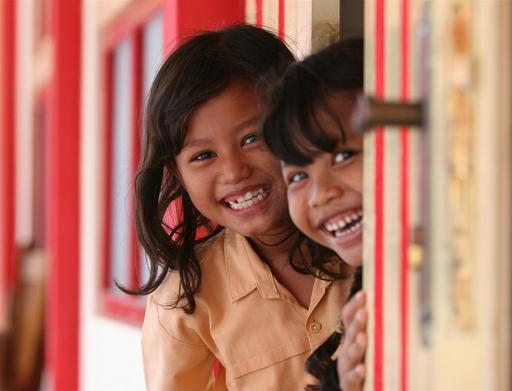 Children frolick in and around the newly built elementary school campus of SDN Cot Meuraja in Aceh Besar, in the subvillage of the same name.