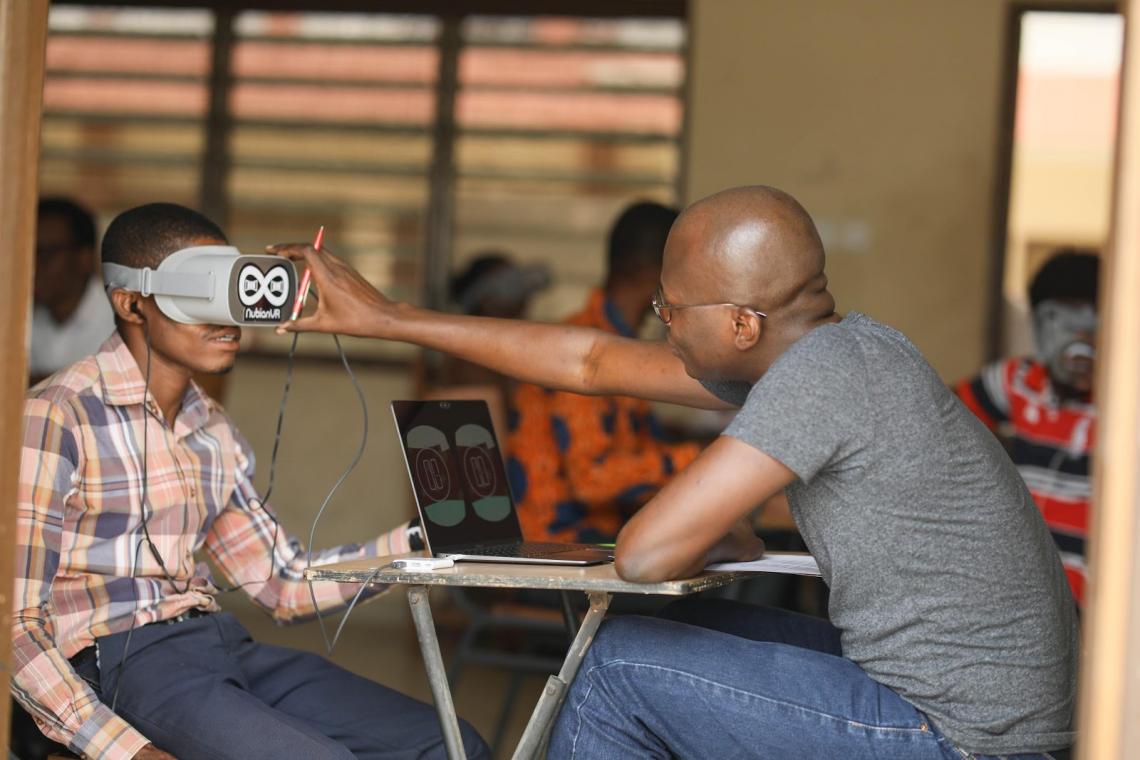 Kabiru Seidu (right), co-founder of NubianVR, demonstrating VR technology with one of the educators in Ga-East District.