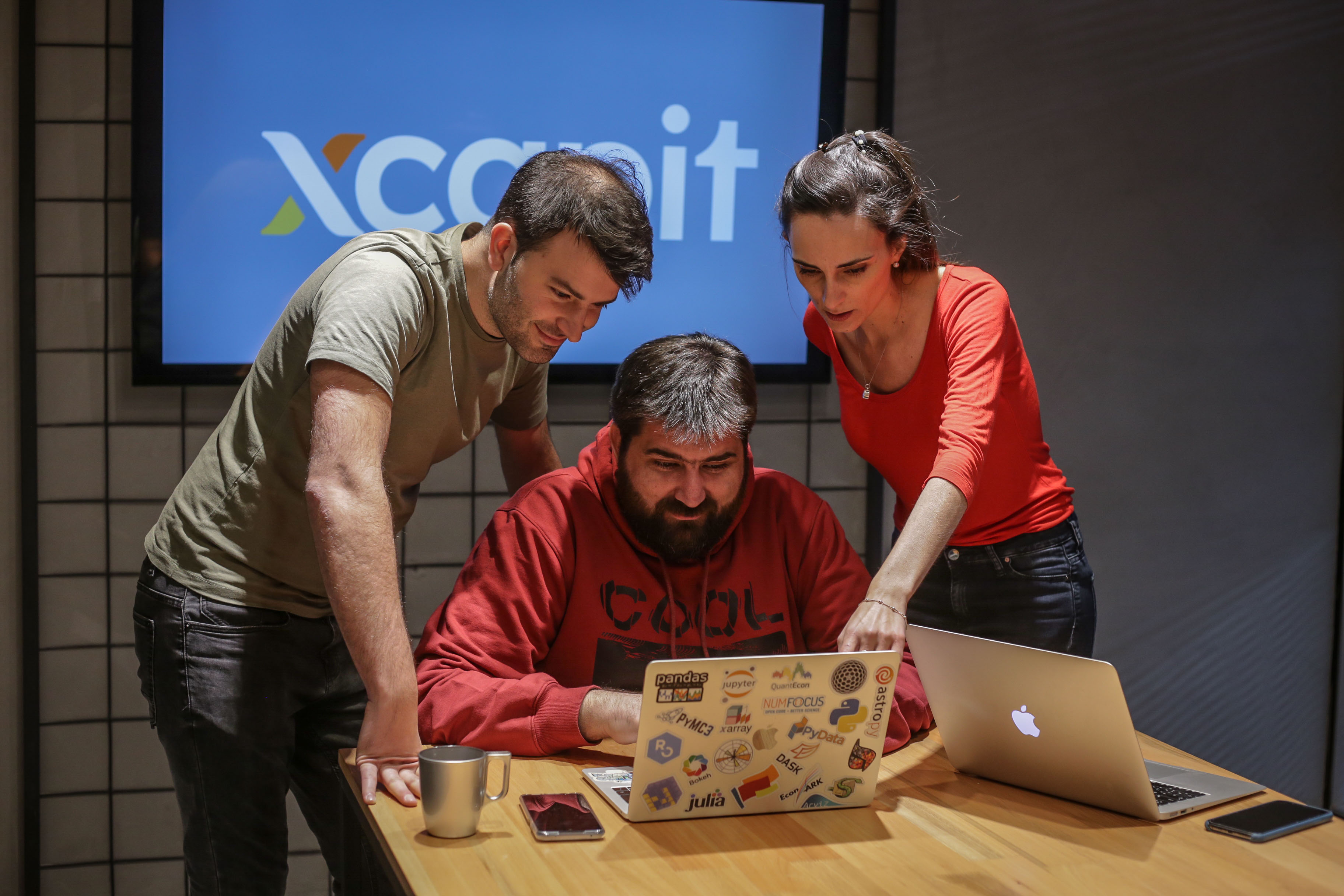 Team xcapit at a meeting 