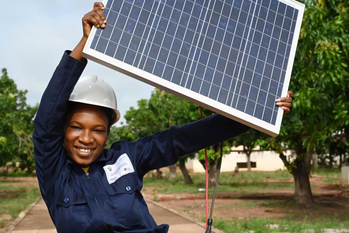 Child with solar panel - credit: UNICEF Cote d'Ivoire