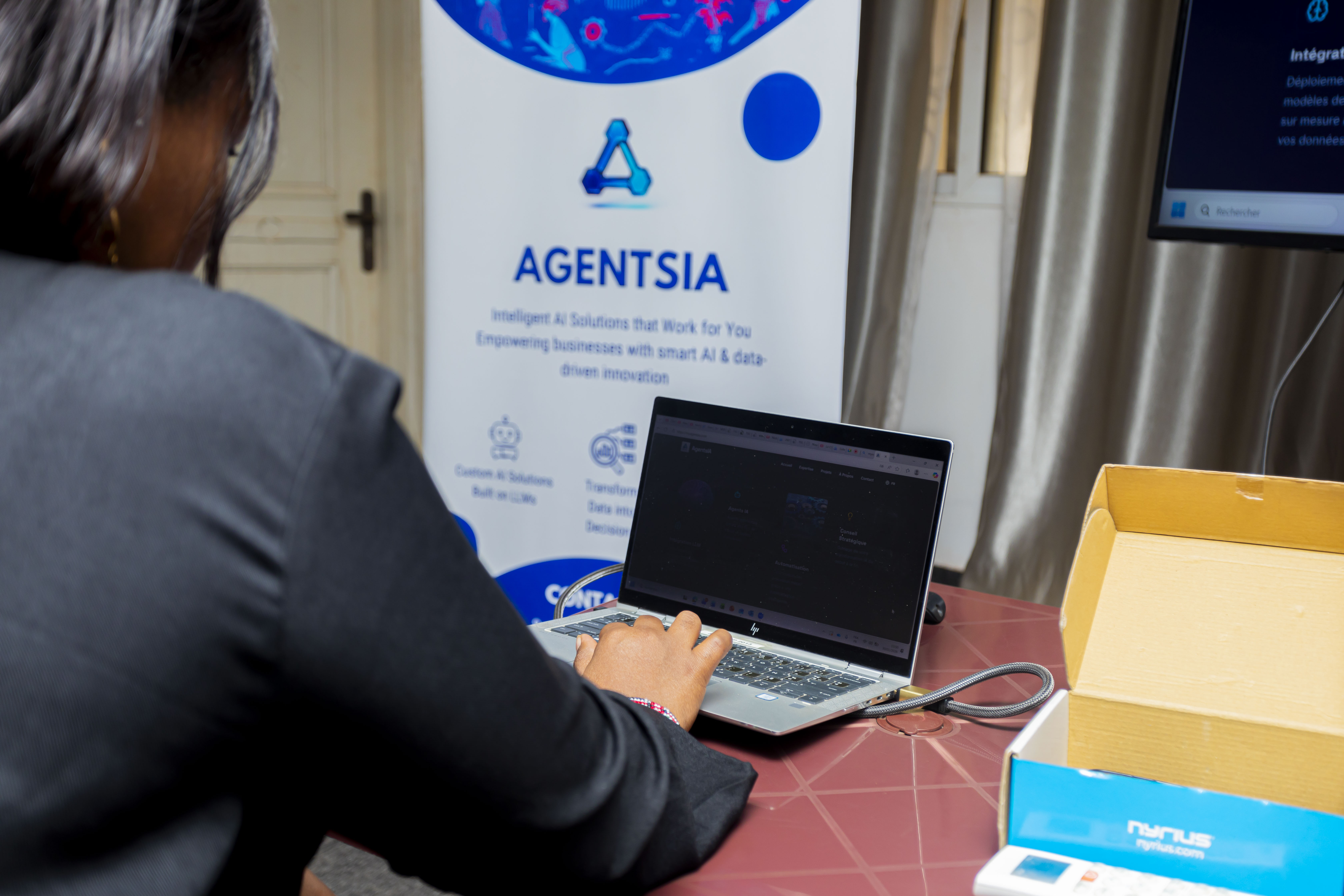 AGENTSIA banner in the background