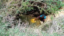 Girl fetching unsafe water 