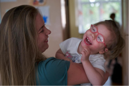 Child playing with caregiver