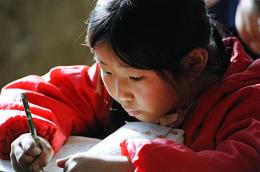 Portrait of a girl writing 