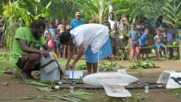 Registered nurse, Miriam Nampil, 55 years, receives the first vaccine delivery from Swoop Aero drone in Cook’s Bay, on 18 December 2018.