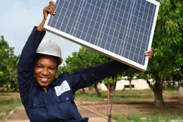 Child with solar panel - credit: UNICEF Cote d'Ivoire