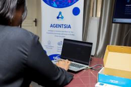 AGENTSIA banner in the background