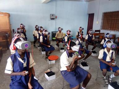 Children in a classroom using Imisi 3D headsets 